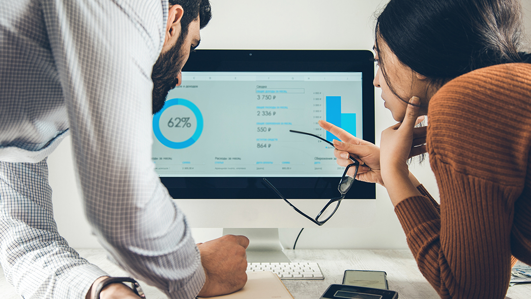 Two business professionals reviewing numbers