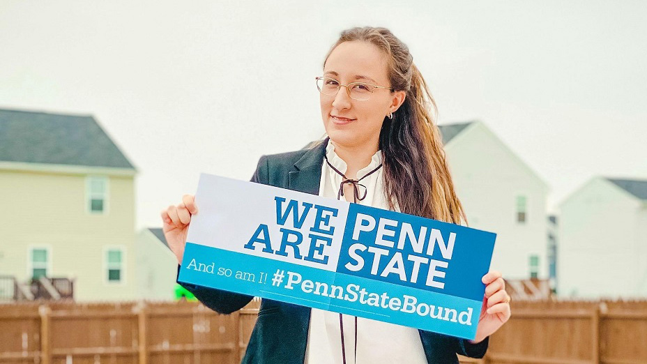 A new student holding a sign that reads, We Are Penn State and #PennStateBound