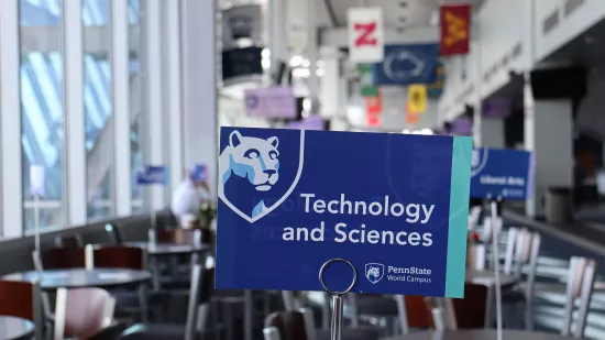 A sign reads, "Technology and Sciences" in a lobby area.